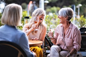 happy-senior-women-drinking-wine-and-laughing-royalty-free-image-987789036-1559144413